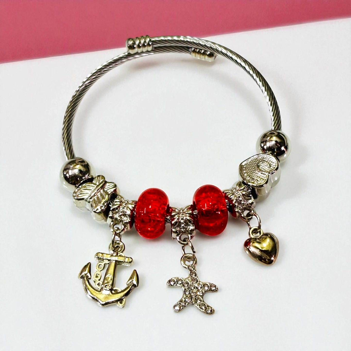 Silver Tone Charm Bracelet with Red Beads.