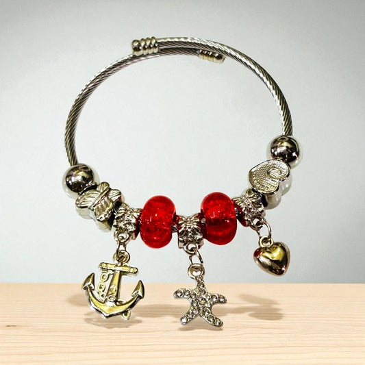 Silver Tone Charm Bracelet with Red Beads.